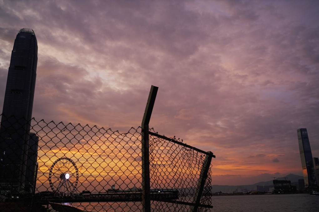 The skyline of Hong Kong’s business district silhouetted at sunset as typhoon Mangkhut approached last weekend. Officials on both sides of the border with the mainland are now discussing the likelihood of Hongkongers being able to open Chinese bank accounts there remotely. Photo: AP