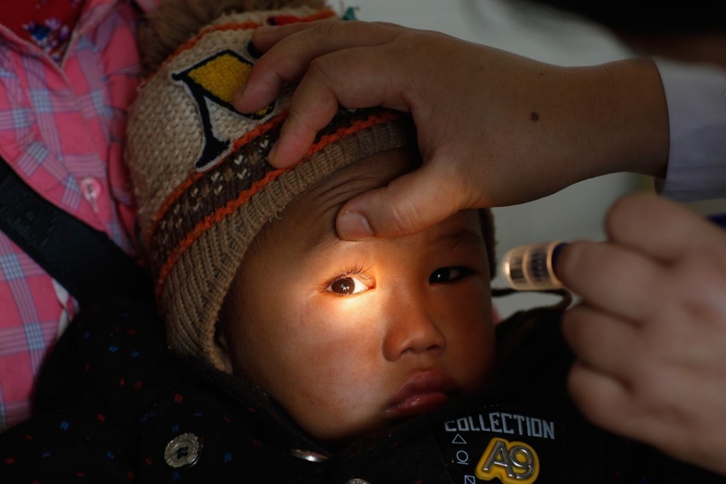 Four-year-old Xiaolong, from a rural area of southwest China, was diagnosed as having cataracts by visiting doctors and received surgery to correct them with the help of an NGO. Photo: Handout