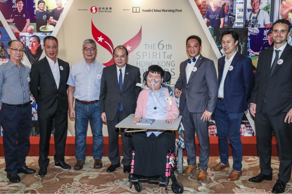 Chief Secretary Matthew Cheung Kin-chung (fourth from left) with award winners (from left) Li Yi-hsin, Chan Cheuk-ming, Ng Kwok-hung, Josy Chow Pui-shan, Ivan Chan Hon-man, Samuel Hui Sing-kwong and Jeff Rotmeyer. Photo: Felix Wong