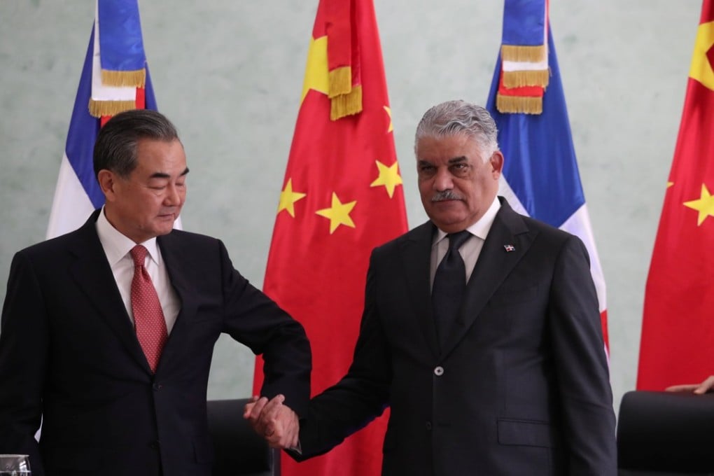 China’s Wang Yi and the Dominican Republic’s Chancellor Miguel Vargas shake hands as Beijing opens its new embassy on Friday. Photo: Reuters