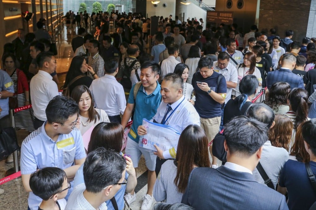 Potential buyers queue up for SHKP's residential project St Martin at the International Commerce Centre (ICC) in West Kowloon on July 14, 2018. Photo: Dickson Lee