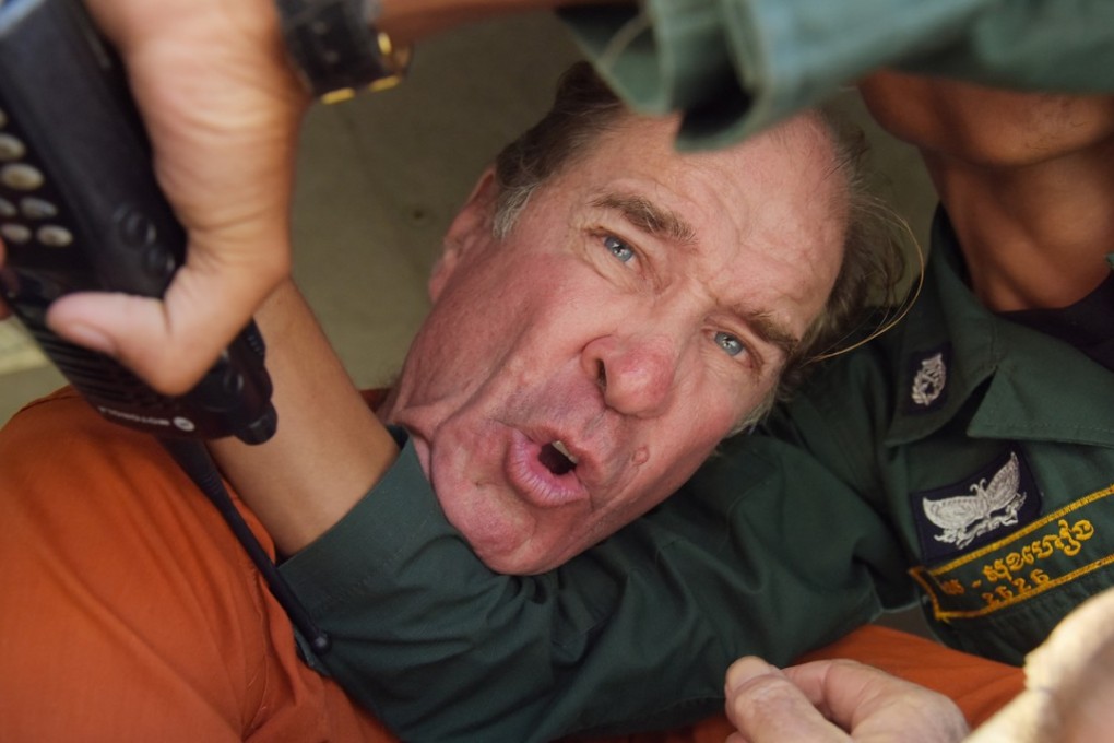 File photo of Australian filmmaker James Ricketson in a police van in Phnom Penh. Photo: EPA