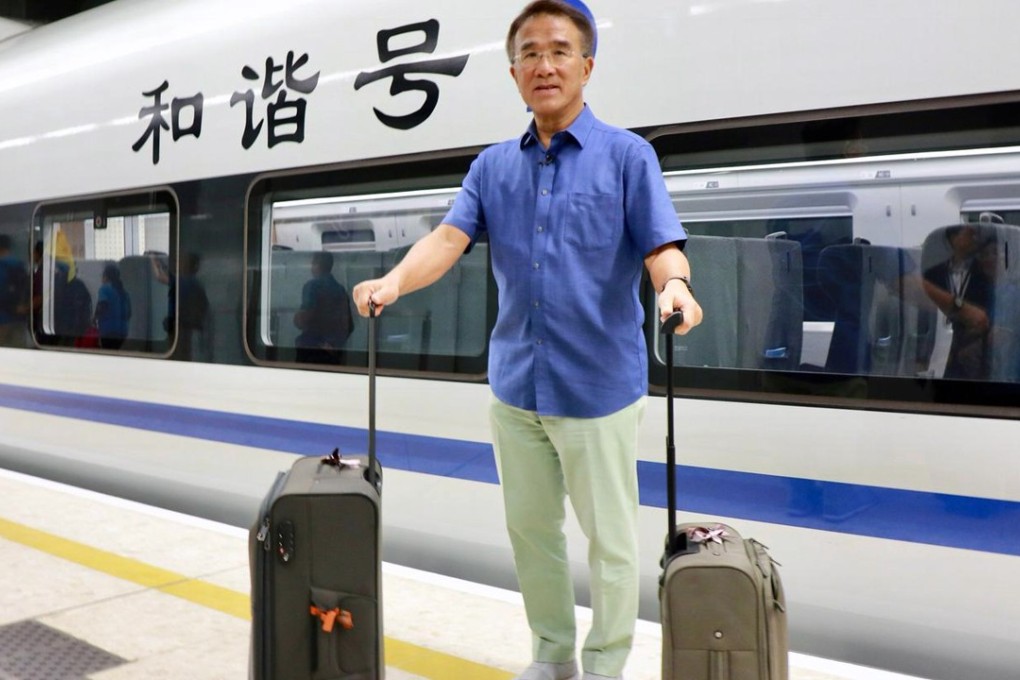 Lawmaker Michael Tien was among the first passengers on opening day of the high-speed rail link. Photo: Facebook