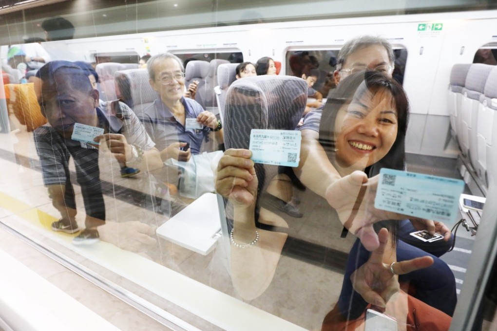 Passengers on the first train to Shenzhen from Hong Kong. Photo: Dickson Lee