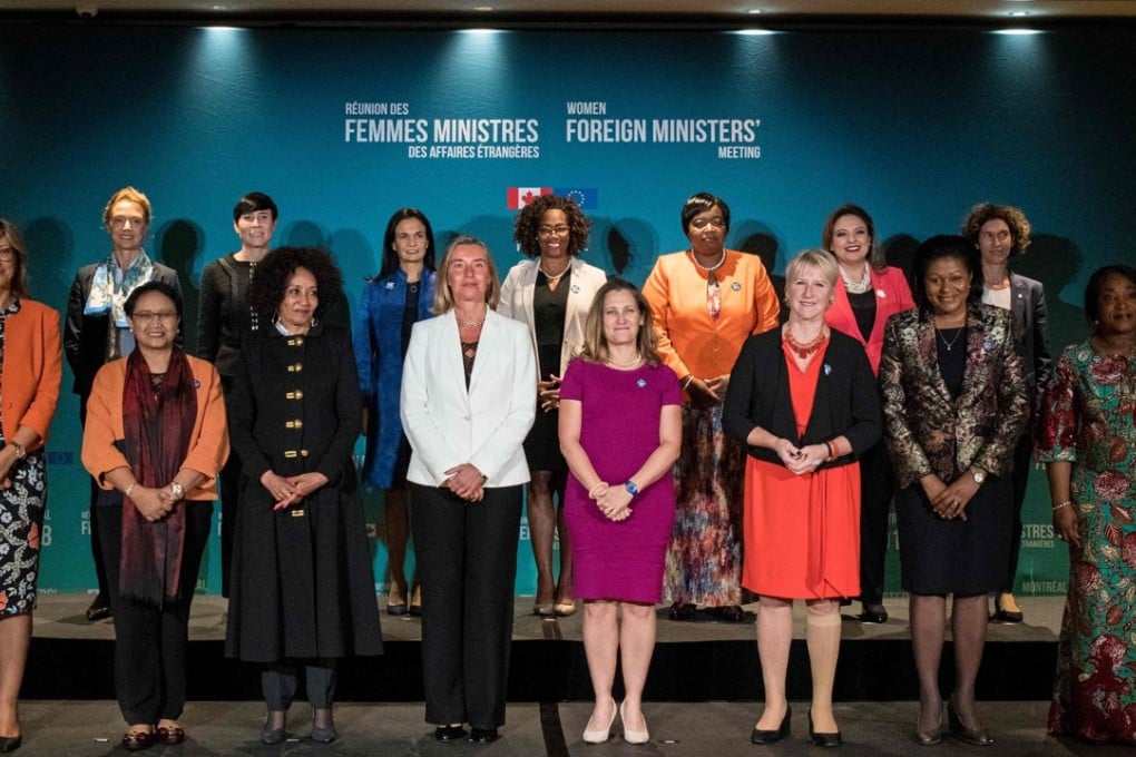 The foreign ministers pose for the ‘family photo’. Photo: AFP