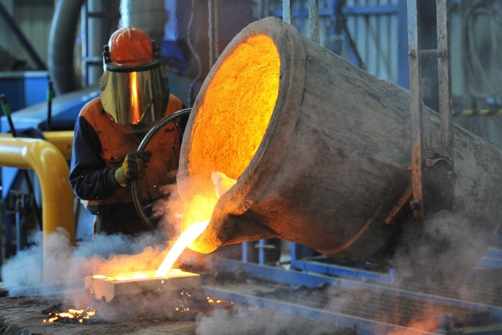 A factory worker pours molten iron at Backwell IXL in Geelong in Geelong, Australia on 30 April 2014. Photo: EPA-EFE
