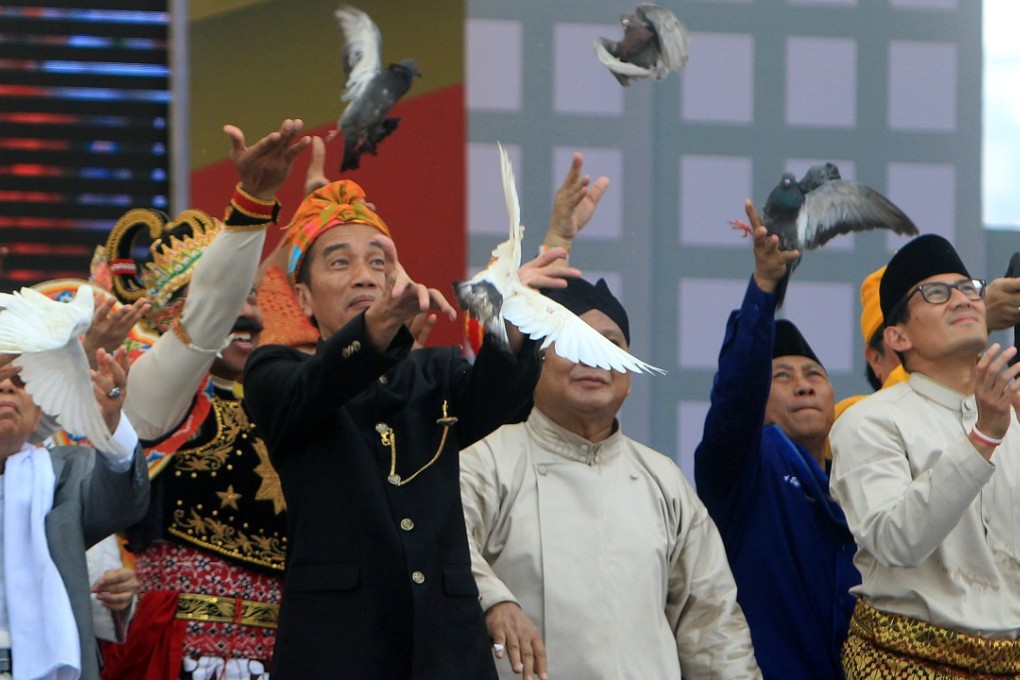 Campaigning for Indonesia’s presidential election officially began Sunday with the two contenders releasing white doves and vowing a peaceful race as concerns simmer the campaign will sharpen religious and ethnic divides. Photo: EPA