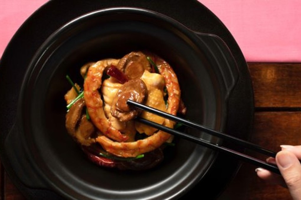 Man Wah’s braised chicken and abalone in casserole with sun-dried shrimp and chilli. Photo: courtesy Mandarin Oriental
