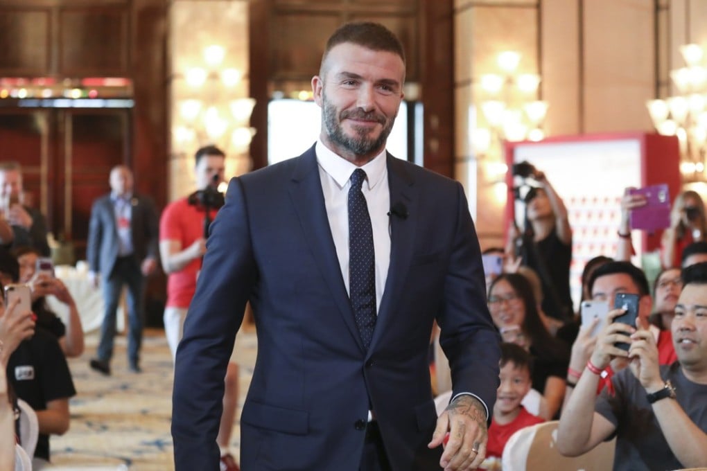 A picture of health: AIA global ambassador and former English football captain David Beckham strides into the room with his usual confidence and ease, at the Four Seasons Hotel in Hong Kong on Monday. Photo: Nora Tam