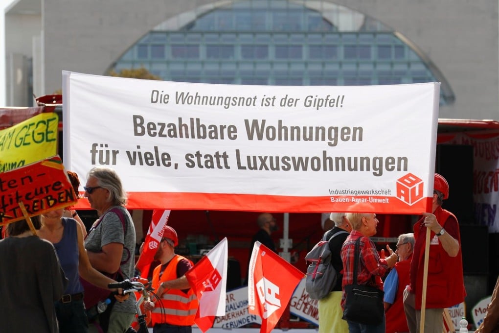 Demonstrators protest against last Friday’s housing summit on rising rents and a shortage of affordable housing in front of the Chancellery in Berlin. Photo: Reuters