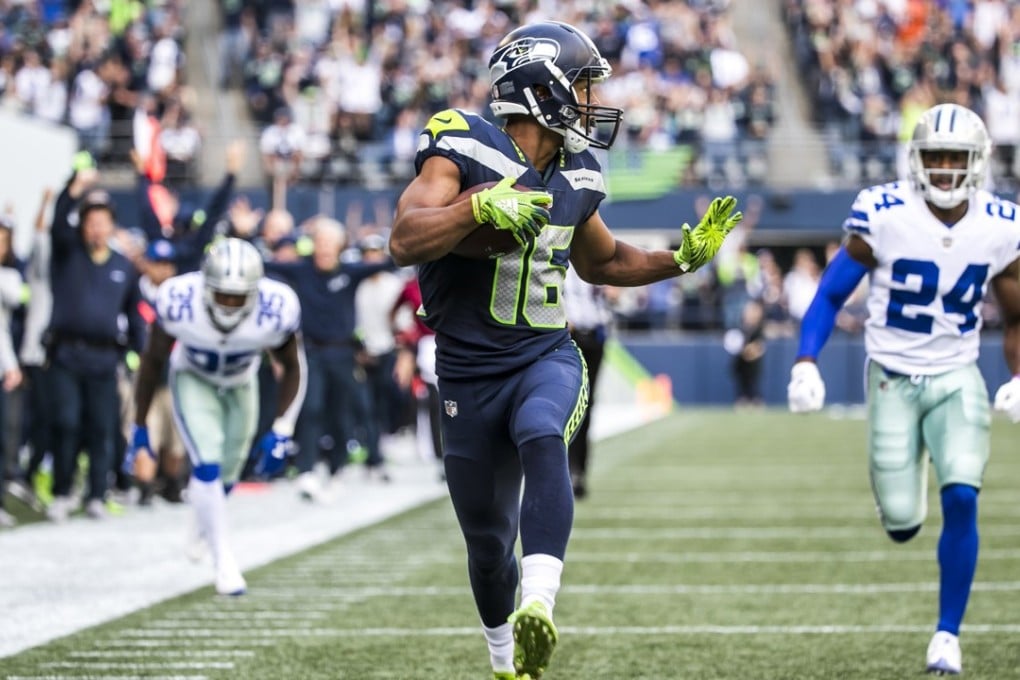 Seattle Seahawks wide receiver Tyler Lockett tip-toes in a 52-yard touchdown in the second quarter against the Dallas Cowboys. Photo: TNS
