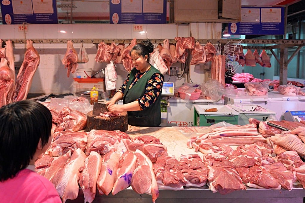 A butcher’s stall at a Beijing market. A low-carb diet that relies too much on meat as a source of protein has been linked to a shorter lifespan. Photo: AFP