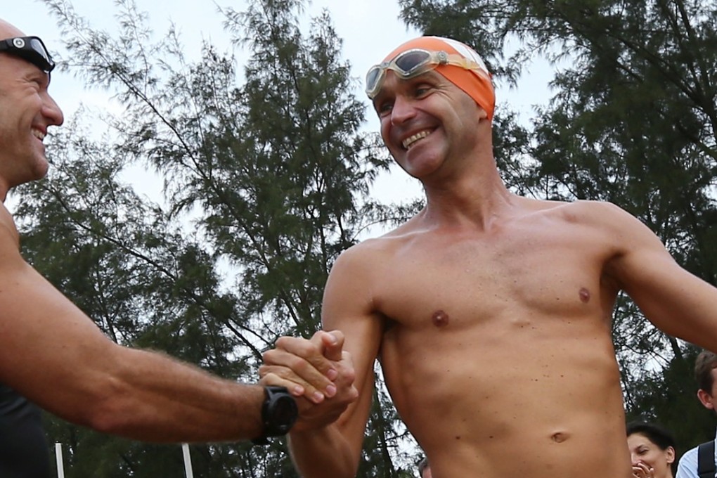 Olivier Baillet (right) and Bruce Pye start from Tai Pak Wan on their ‘75km Round Lantau Island Swim Challenge’ in 2014. Baillet believes ‘staying present’ in mind helps physical performance. Photo: Nora Tam