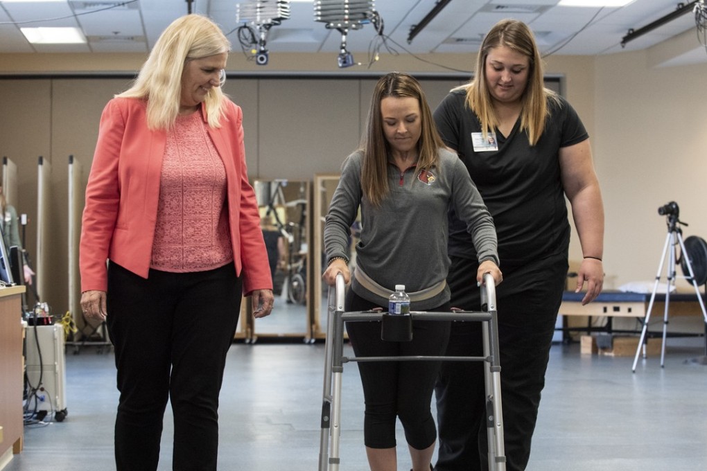 Kelly Thomas is one of several people with spinal cord injuries who are standing, taking steps and – in her case – walking without help, thanks to an experimental combination therapy. Photo: AP