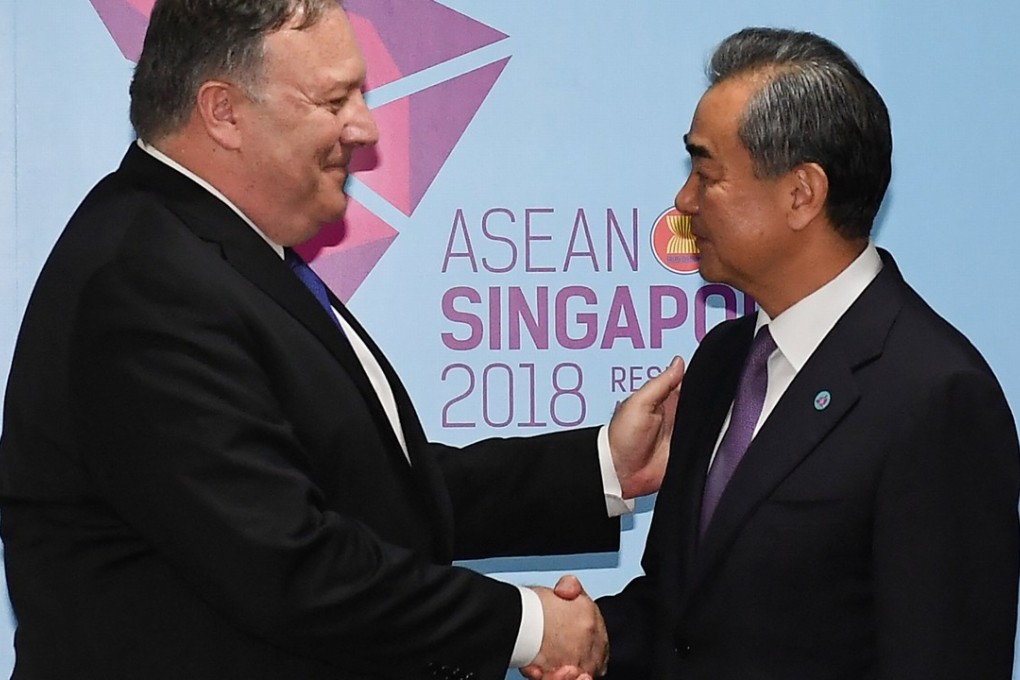 US Secretary of State Mike Pompeo and Chinese Foreign Minister Wang Yi shake hands before their bilateral meeting in Singapore on August 3. Photo: Reuters