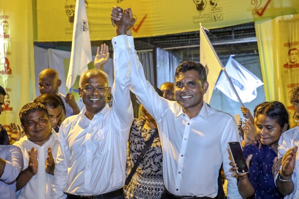 Maldives president-elect Ibrahim Mohamed Solih (centre left) celebrates with his running mate Faisal Naseem in Malé on Monday. Photo: AP