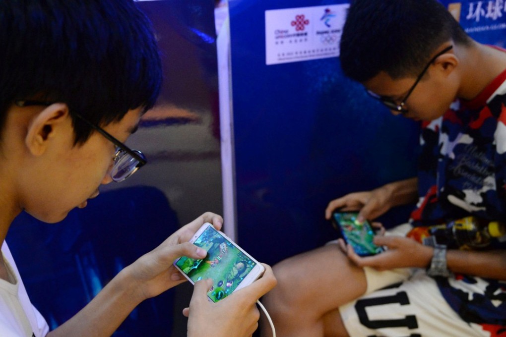 Young boys play Tencent’s Honour of Kings. The Chinese government has called for action to prevent myopia among children who spend too much time playing online games. Photo: Reuters
