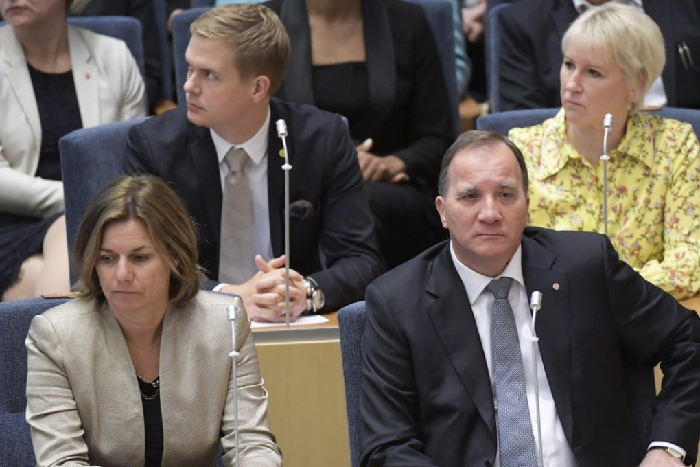 Swedish Prime Minister Stefan Lofven (R) looks on as he was ousted in a no-confidence vote in the Swedish Parliament Riksdagen in Stockholm. Photo: EPA