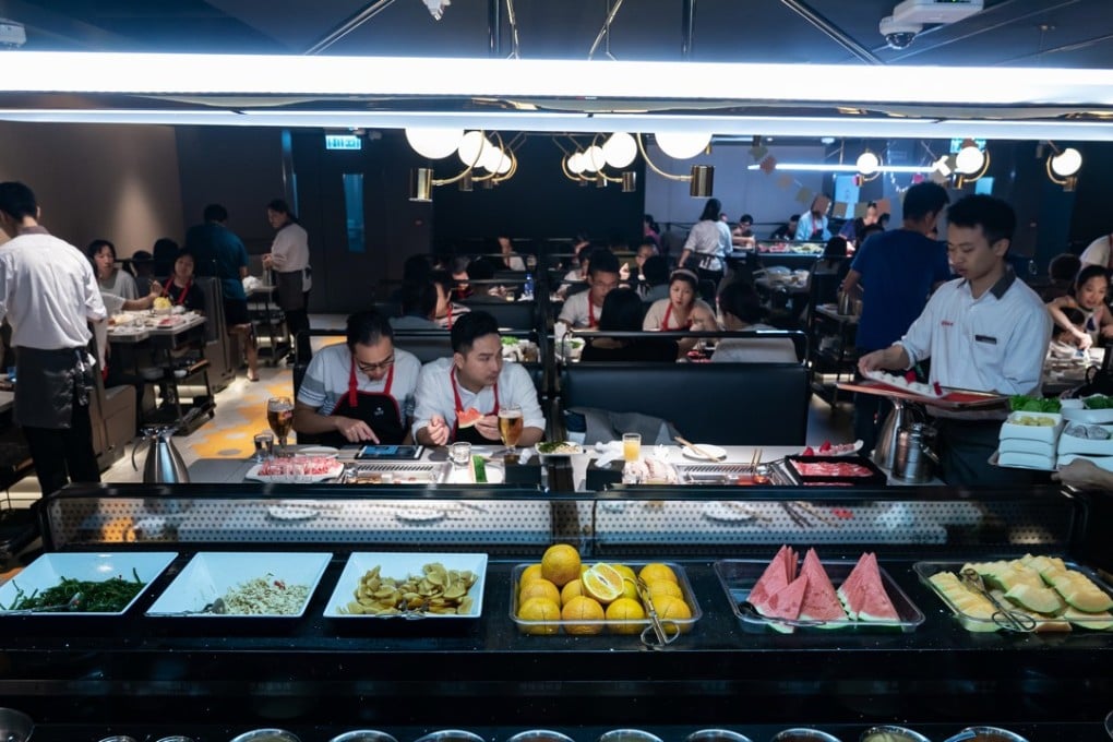 Customers at a Haidilao hotpot restaurant in Hong Kong, on Saturday, September 22, 2018. Shares of Haidilao, China's biggest hotpot restaurant chain, rose as much as 10 per cent from its IPO price, giving the company a market value of HK$97 billion. Photo: Anthony Kwan/Bloomberg