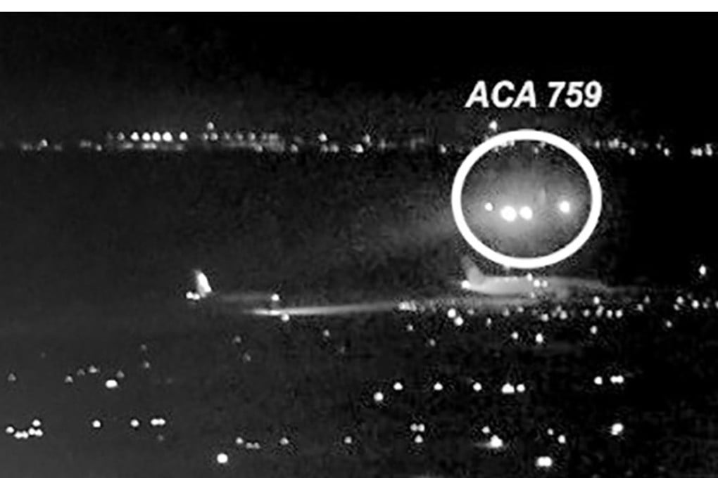 This image released by the National Transportation Safety Board (NTSB) shows Air Canada flight 759 (ACA 759) attempting to land at the San Francisco International Airport on July 7, bottom. The plane almost landed on four other airliners waiting on a taxiway. Photo: NTSB
