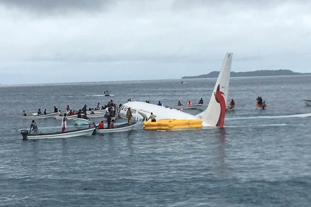 People are rescued from an Air Niugini plane which crashed in the waters in Weno, Chuuk, Micronesia on September 28, 2018. Photo: James Yaingeluo/Reuters