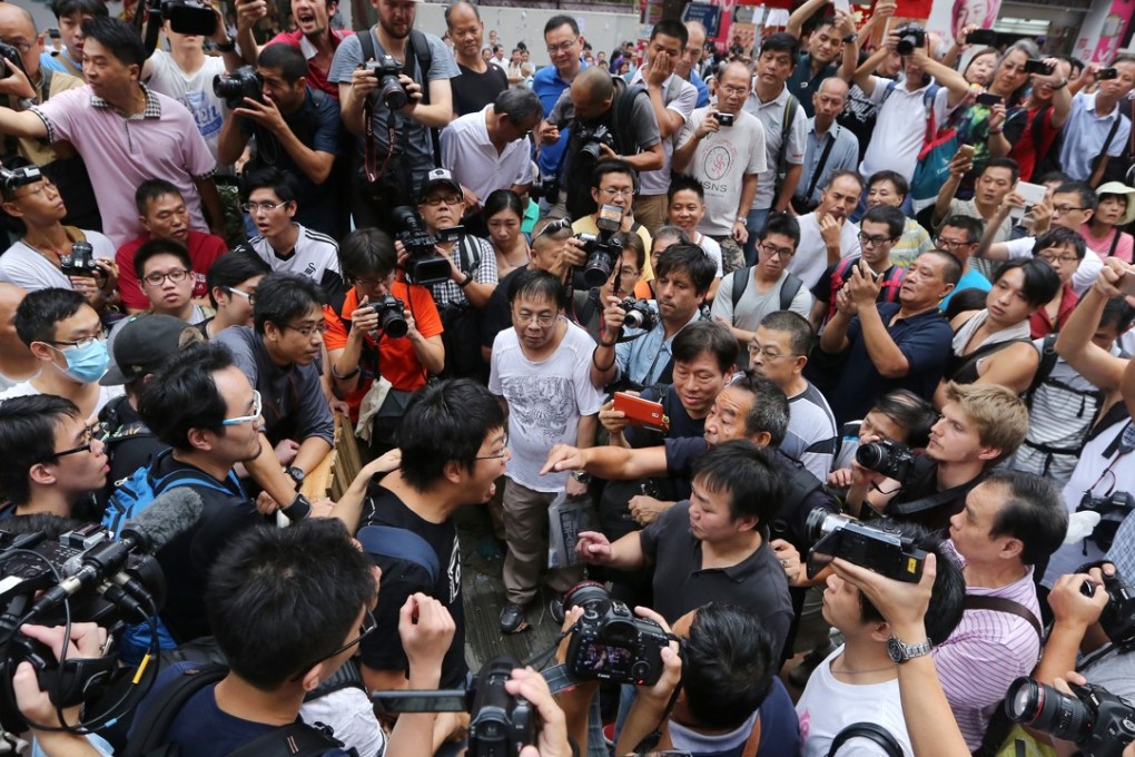 Anti-Occupy protesters clash with pro-democracy protesters at a protest site in Mong Kok in October 2014. Photo: Sam Tsang