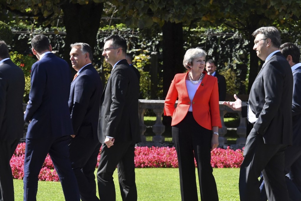 Heads of government walk past British Prime Minister Theresa May after a photo at an informal European Union summit in Salzburg, Austria, on September 20. Photo: AP