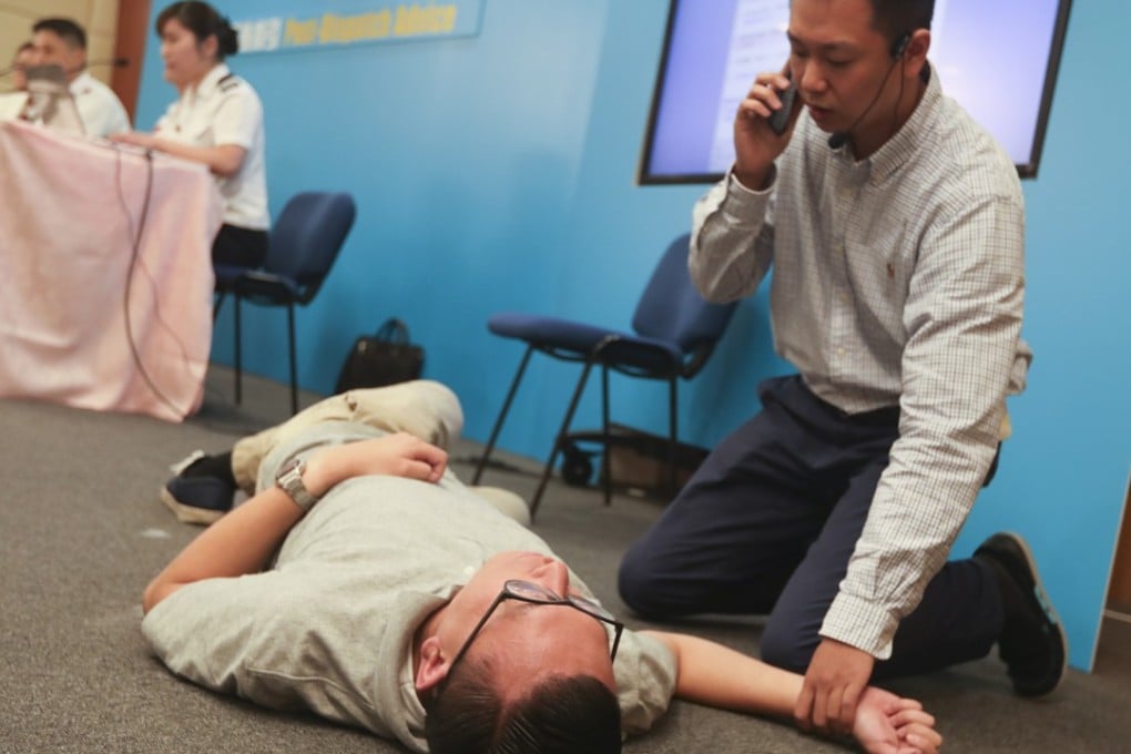 Fire services staff demonstrate how the advice can help patients. Photo: Xiaomei Chen
