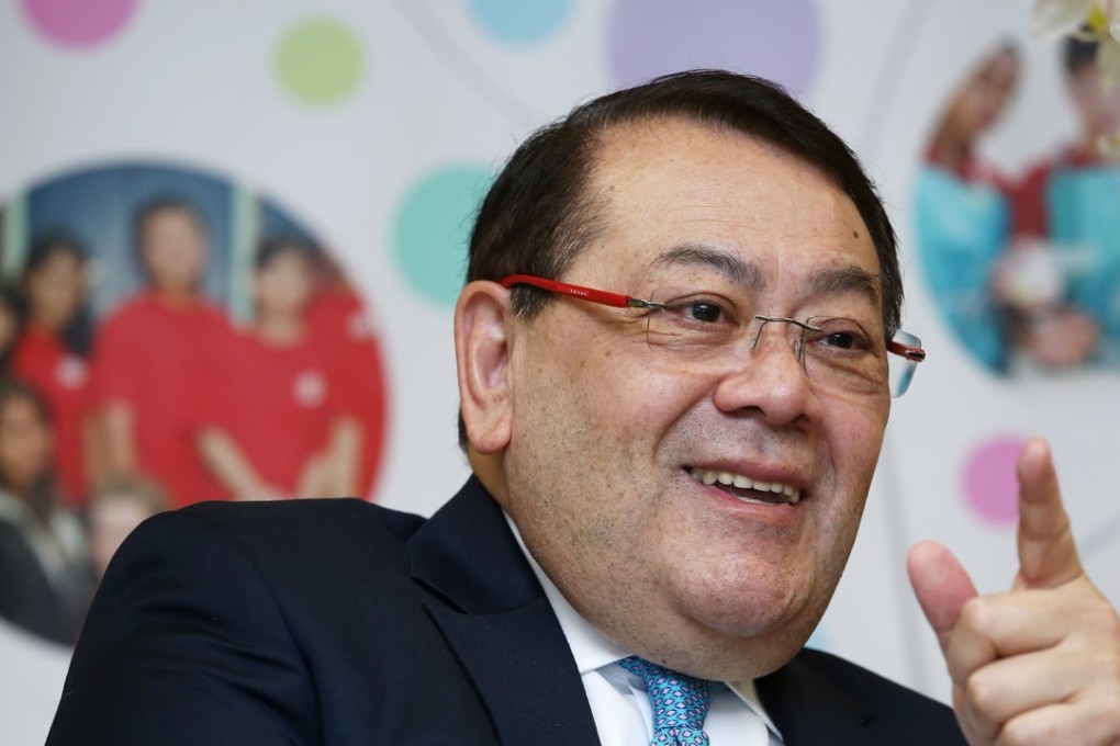 Abraham Razack sits on the boards of 18 publicly traded companies as an Independent Non-Executive Director, taking home over HK$5 million (US$639,000) in annual fees. Photo: SCMP