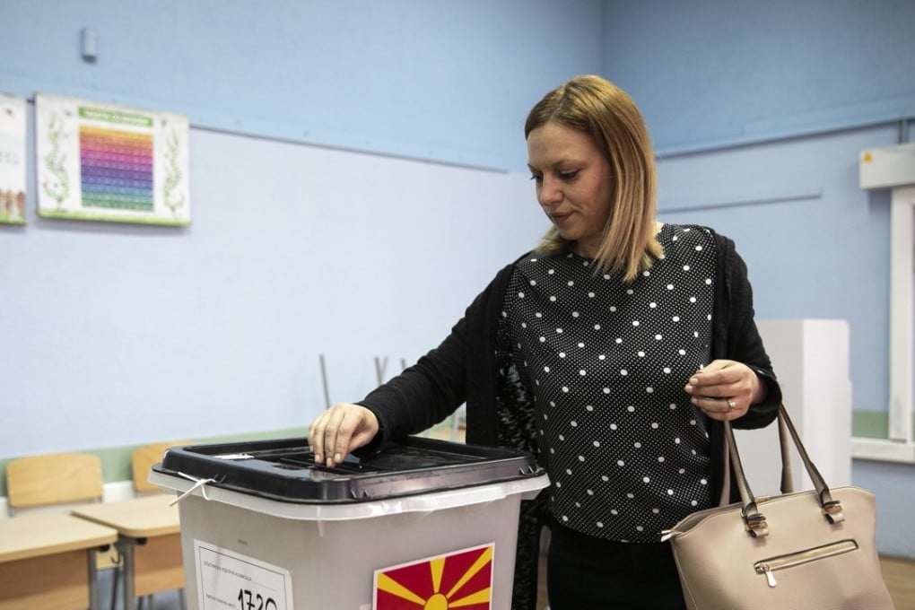 A woman casts her ballot at a polling station during a referendum, in Strumica, Macedonia. Photo: Bloomberg