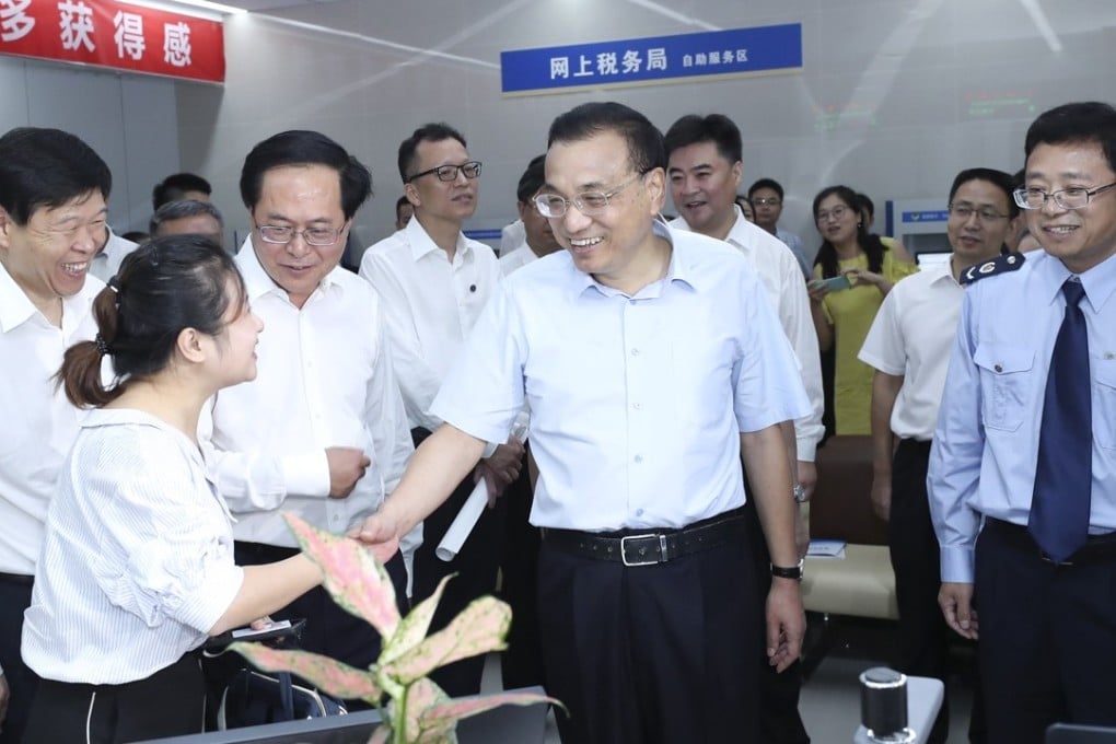 Chinese Premier Li Keqiang (centre) said it is a priority for the government to provide a level playing field for all businesses, domestic and foreign. Photo: Xinhua