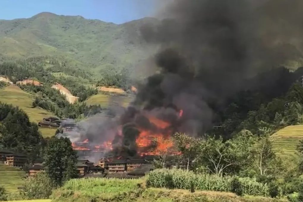 The fire engulfed the village on Sunday afternoon. Photo: Qq.com