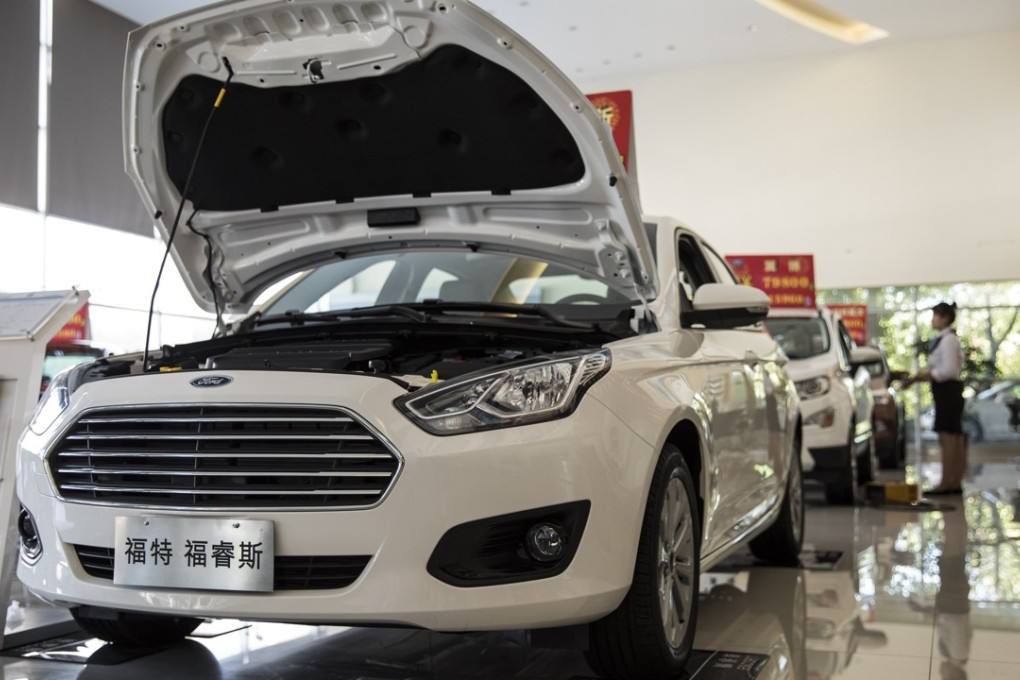 A Ford vehicle stands on display at a showroom in Shanghai. The US-China trade war is taking a toll on companies from both sides. Photo: Bloomberg
