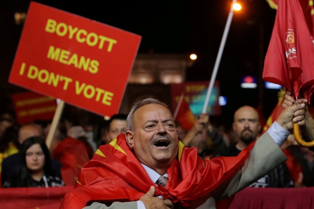 Protesters shout out slogans about boycotting the referendum on changing the country's name. Photo: Reuters