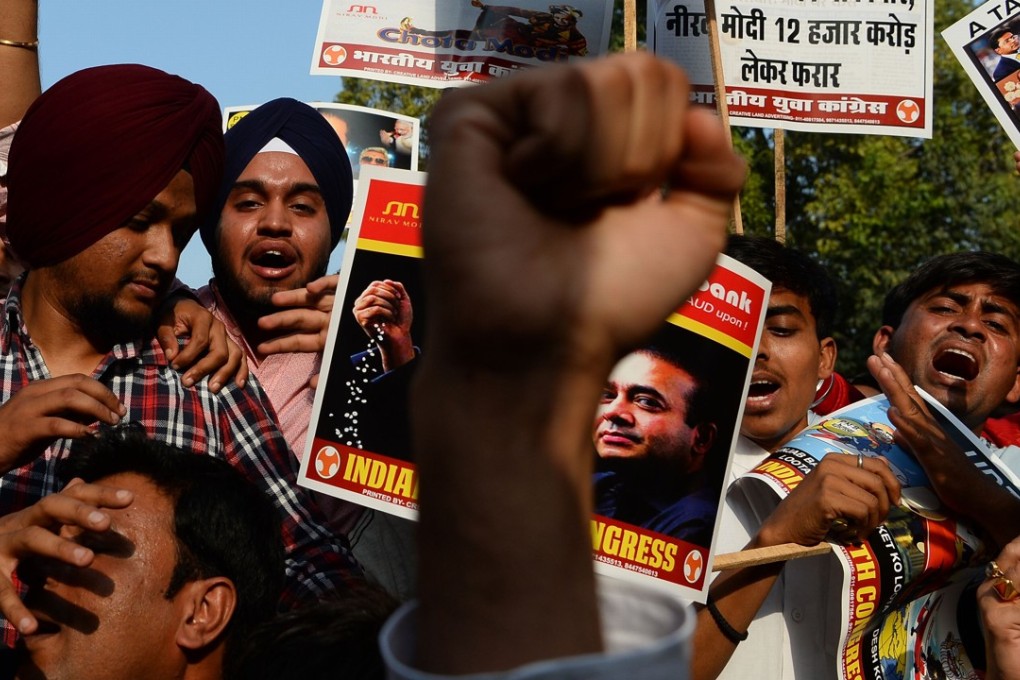 A protest against billionaire jeweller Nirav Modi and India’s Finance Minister Arun Jaitley in the wake of the Punjab National Bank banking fraud scandal in New Delhi. Photo: AFP