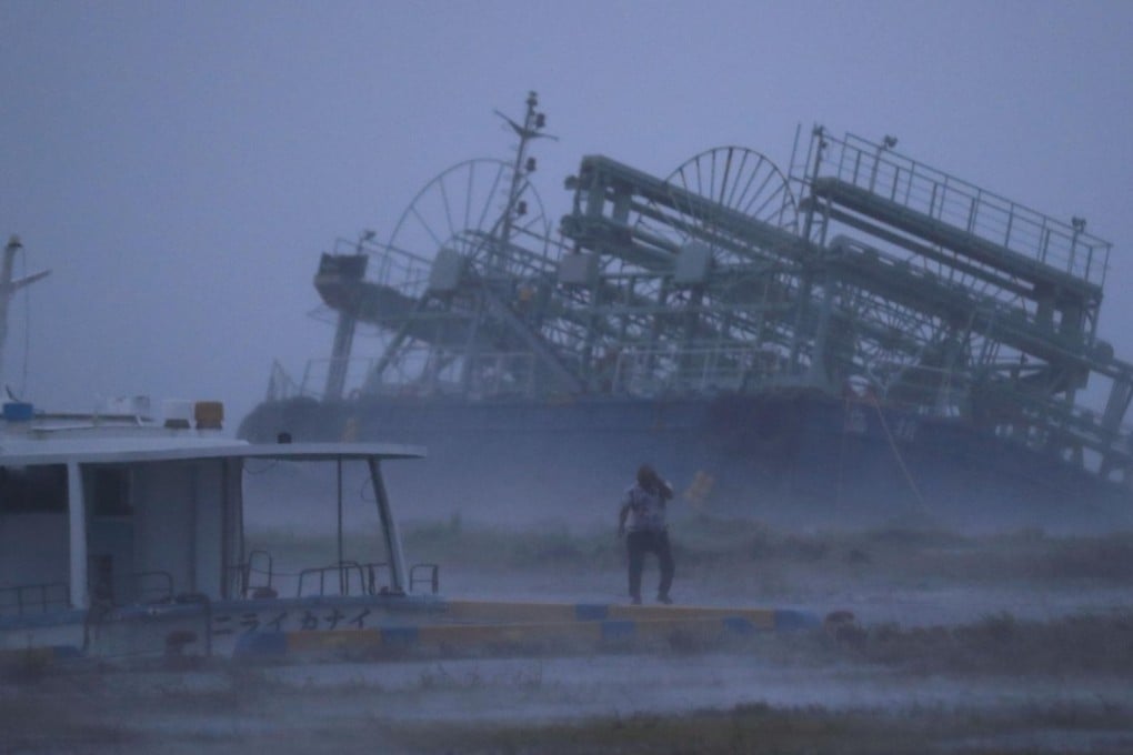 A ship washes ashore at a port in Yonabaru, Okinawa, as Typhoon Trami approaches Japan's southernmost prefecture. Photo: Kyodo