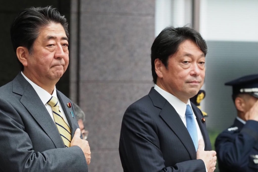 Japan’s Prime Minister Shinzo Abe and former defence minister Itsunori Onodera. Photo: AFP