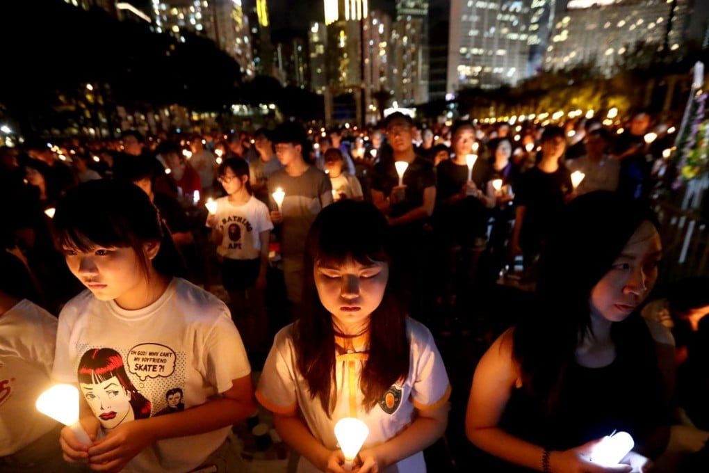 Young people take part in the annual candlelight vigil at Victoria Park to mark June 4, on the 29th anniversary of the Tiananmen Square crackdown in 2018. Sara Ko (centre) is a Form Three student. Photo: Nora Tam