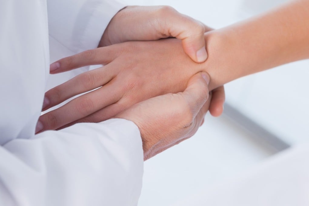 Wrist problems including tendinitis are common in new mothers from carrying newborns. Photo: Alamy