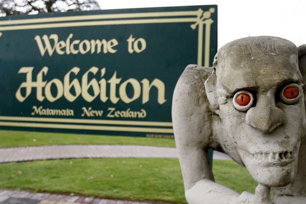 A sculpture of Gollum, the villainous Lord of the Rings hobbit, stands in front of a welcome sign in Hobbiton Town, Matamata, New Zealand. Photo: AP