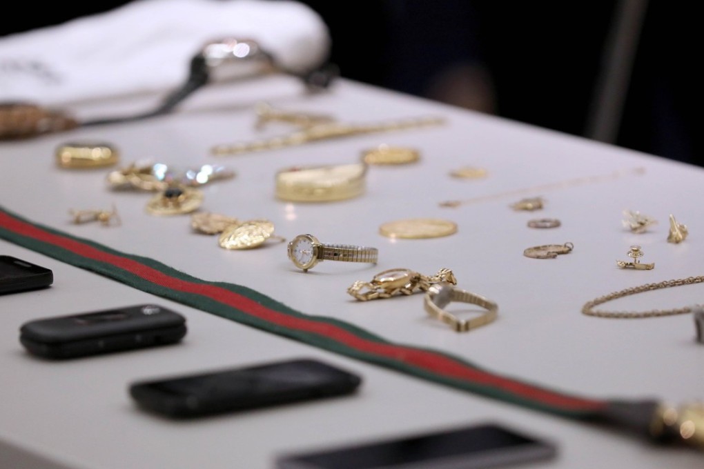 Police on Tuesday displayed seized items believed to have been stolen - including expensive purses, handbags, watches and jewellery - in the hopes that the victims could identify them. Photo: TNS