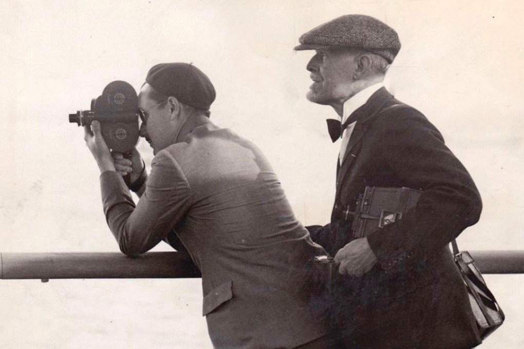 Burton Holmes (right) with cameraman André de la Varre, on ocean liner SS Île de France.