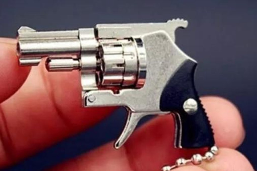 A Chinese man has been arrested for selling tiny gun key chains online because they are more powerful than the law allows. Photo: Thepaper.cn