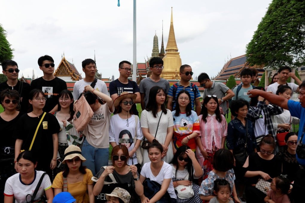 A group of Chinese tourists at the Temple of the Emerald Buddha in Bangkok, in August 2018. Picture: Reuters