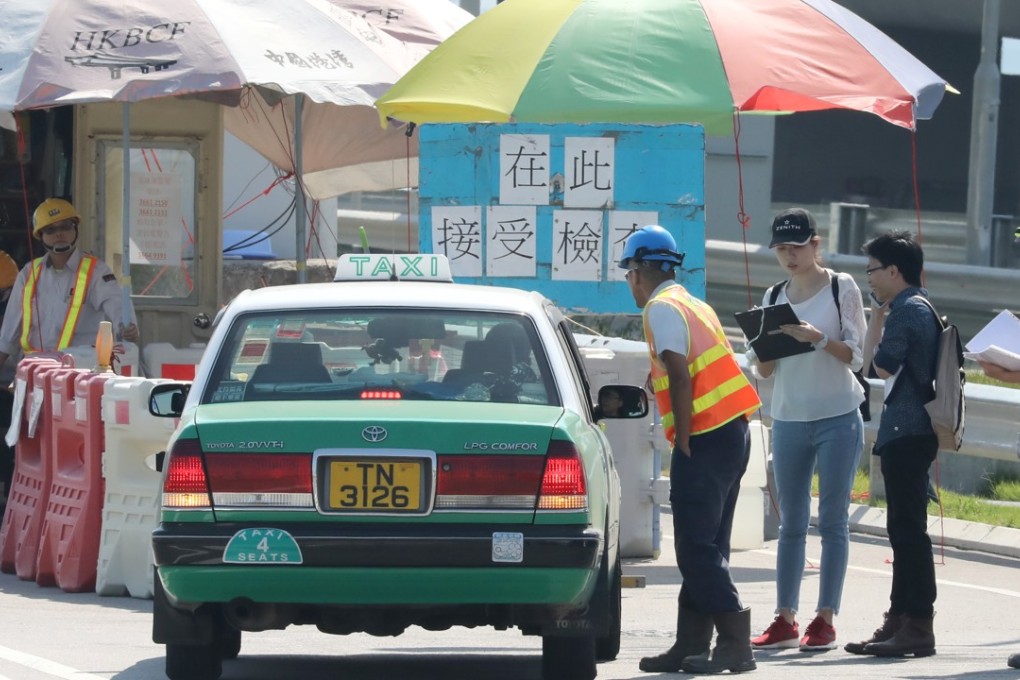 About 80 cabbies did a trial run of taxi facilities at the bridge’s Hong Kong immigration port. Photo: K.Y. Cheng
