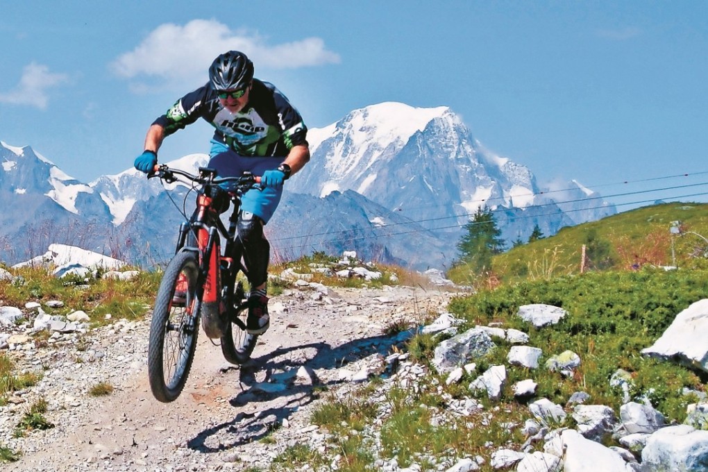 Reporter Alf Alderson flies down a trail on his e-bike in Les Arcs, France. Photo: Allan Verdon