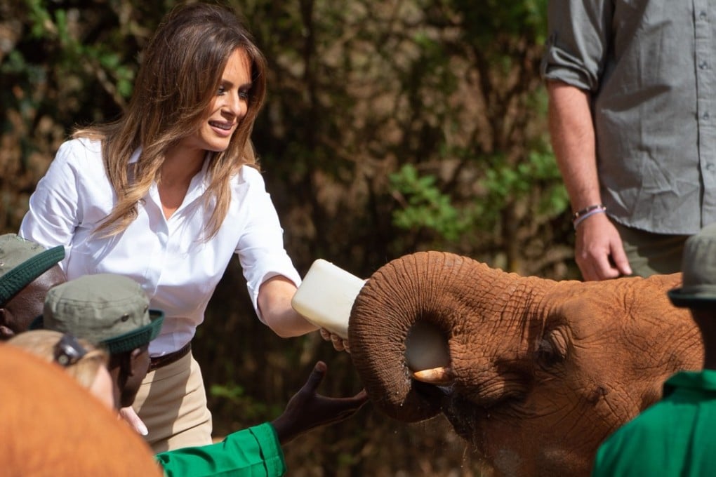 US First Lady Melania Trump feeds a baby elephant at The David Sheldrick Elephant Orphanage in Nairobi on October 5, 2018, as she pays a one-day visit to the country during her solo tour of Africa promoting her children's welfare programme. Photo: AFP