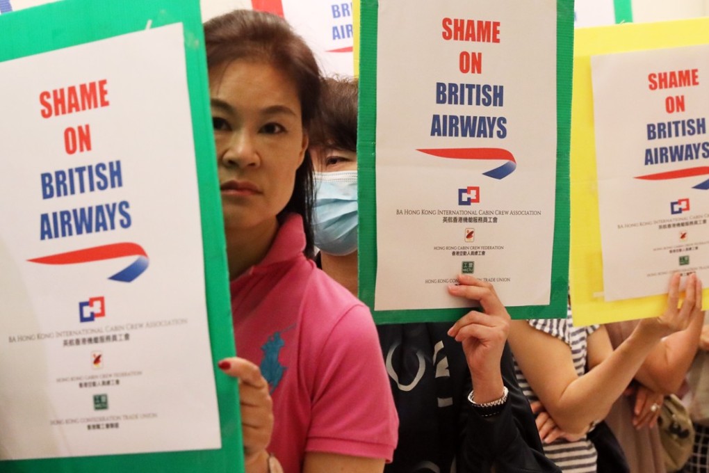 A group of about 20 Cantonese-speaking crew members waited outside the British Airway’s closed office in Sheung Wan on Thursday, after the airline said last week it would close its Hong Kong cabin crew base at the end of October. Photo: Felix Wong