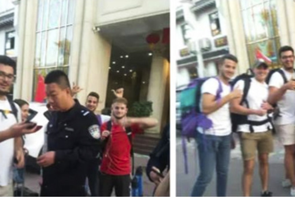 Police help transfer foreign tourists after a hotel mix-up in Luoyang, Henan province. The authorities were notified, deployed a translator and helped arrange for them to move to another hotel after their original hotel failed to take in so many of them. Internet users react to draw a contrast between how foreigners were treated in their motherland versus the recent Sweden incident. Photo: news.163.com