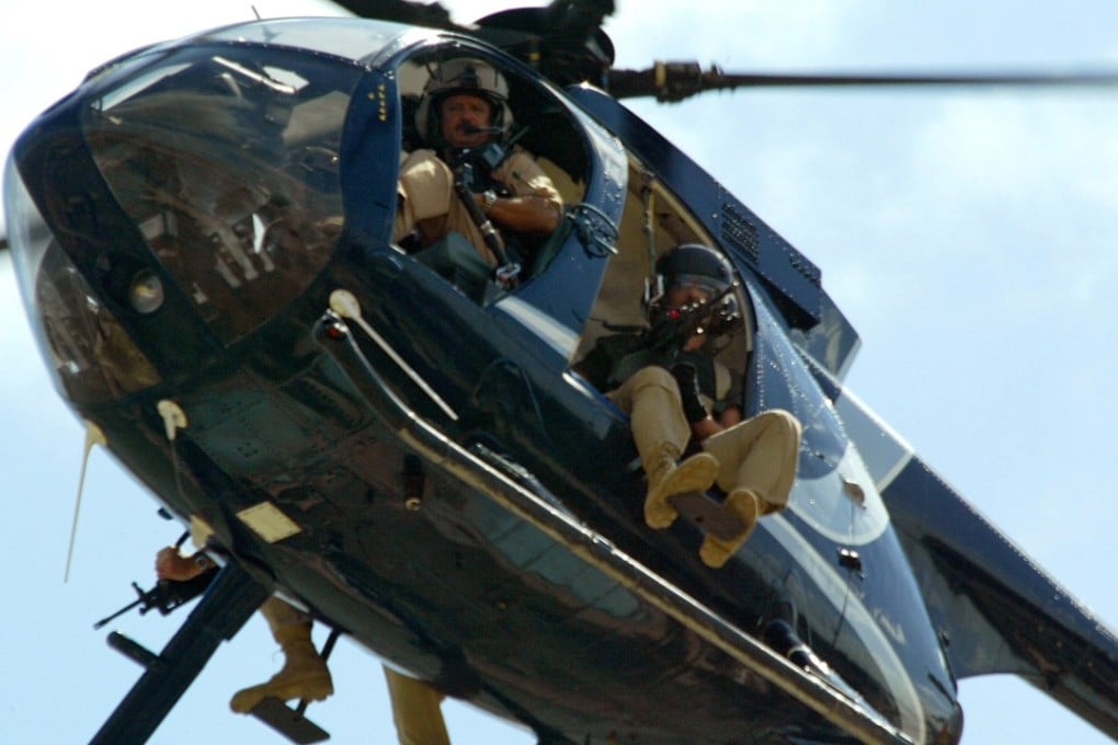 Members of the US private security company Blackwater patrolling over Baghdad. Photo: AFP Photo
